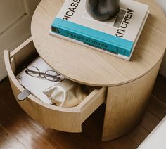 a table with some books and glasses on it