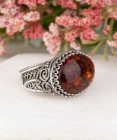 Natural Authentic Amber 925 Sterling Silver Handmade Artisan Crafted Filigree Oval East West Statement Ring Material: 925 Solid Sterling Silver Natural Amber Dimensions: 18 mm x 13 mm oval Ring Face Length: 0.60 inches Width: 0.80 inches Comes with a gift pouch and box Free Domestic Shipping Excellent quality, have sold in the USA, Canada, Italy, Germany and the UK, and received hundreds five star reviews. It is a gift that will create memories for years to come. Our fine silver jewelry is Made Antique Dome Ring With Polished Finish As Gift, Antique Polished Dome Ring Gift, Antique Dome Ring With Polished Finish, Spiritual Oval Ring With Intricate Design, Spiritual Oval Rings With Intricate Design, Antique Oval Filigree Ring Gift, Handmade Oval Dome Ring For Formal Occasions, Elegant Dome Ring Stamped 925 As Gift, Elegant Stamped 925 Dome Ring As Gift