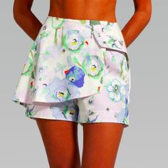 Beautiful Wrap Shorts That You Can Mix And Match Several Tops Or Sweaters, To Create A Look Of Your Own. Feminine Water Color Flowers Print Make It For A Springtime Or Summer Look! Show Off Your Best Asset (Legs!) In This Beautiful Piece! * 100% Cotton Pique * Snap Front Closure * Floral Water Color Print * Wrap Style Mini Shorts * Size Small (4-6) Waist: 27" Hips: 36.5" Brand New, Prices Firm! I Have All My Prices Set Low, So You Get The Best Value. Bundle A Few Items Then I Can Give A Discount Floral Print Summer Pants For Daywear, Summer Floral Print Pants For Daywear, Floral Print Beachwear Bottoms For Spring, Chic Floral Print Cotton Shorts, White High Waist Bottoms With Floral Print, White High Waisted Floral Bottoms, Beachwear Pants With Pockets For Spring, Chic White Floral Print Shorts, Beachwear Bottoms For Spring Day Out