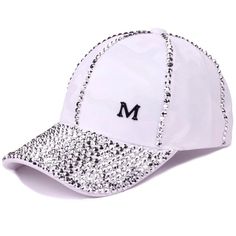 a white baseball cap with silver sequins on the front and black m on the side