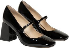 a pair of women's black high heels on top of each other