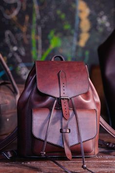 A small leather backpack that is handstitched not only exudes craftsmanship and quality but also showcases attention to detail and a unique touch. It is likely to be durable and have a personalized feel, making it a stylish choice for anyone looking for a functional yet fashionable accessory to carry their belongings.

✔️ Features
• Main compartment with belt buckle.
• external pockets
• Adjustable suspension
• Hand stitched and finished.
Material: natural leather.

Actual colour of the leather is one tone darker.

⇅ Size: 26X22X16 cm. Leather Backpack Women, Small Backpack Purse, Small Leather Backpack, Mini Leather Backpack, Bags Handmade