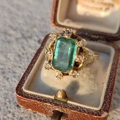 RING SIZE:   8 1/2US, 58 EU [FREE RESIZING] GOLD: 18 k WEIGHT: 5.3 grams STONES: emerald, diamonds EMERALD: 3 ct.  DIAMONDS TOTAL WEIGHT: 0.03ct CUT: rose cut CONDITION: EXCELLENT Beautiful, dainty emerald and diamond Victorian ring from the 1870s with Hungarian import hallmarks from 1867-1922. The emerald is around 3 ct. and has a bright, deep green color and it also features 0.03 ct. rose cut diamonds. The gold has skilfully hand carved designs on it. The ring weighs 5.3 grams, and is size 8 1 Luxury Vintage Emerald Ring With Intricate Design, Vintage Victorian Ring, Antique Ruby Ring Victorian, Emerald Rings Vintage, Victorian Emerald Ring, Antique Emerald Ring Vintage, Gold Emerald Rings, Vintage Engraved Emerald Ring, Victorian Emerald Wedding Ring