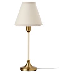 a lamp that is on top of a white surface with a light bulb in the middle