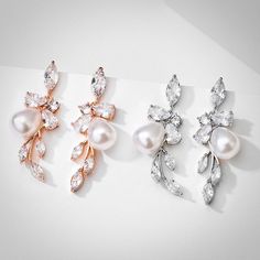 Delicate yet eye-catching, this pair of earrings can complete the most sophisticated of looks. All it takes is a simple glance at this unique design to see its extremely classy look that makes a glamorous and feminine statement. The single pearl is enhanced by flawless cubic zirconia that captures the light from every angle with a perfectly translucent appeal, while the rose gold / rhodium plating offers a flawless finish which perfectly enhances the intricate detailing. Length: 1.4" (approx. 3. Rose Gold Cubic Zirconia Bridal Earrings For Evening, Elegant Rose Gold Chandelier Earrings With Cubic Zirconia, Elegant Rose Gold Crystal Earrings For Formal Occasions, Rose Gold Cubic Zirconia Flower Earrings For Party, Party Rose Gold Pearl Earrings With Cubic Zirconia, Elegant Rose Gold Cubic Zirconia Earrings, Elegant Rose Gold Earrings With Cubic Zirconia, Elegant Rose Gold Drop Bridal Earrings, Delicate Rose Gold Earrings For Party