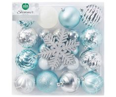 a package of christmas ornaments with snowflakes and baubles in the middle