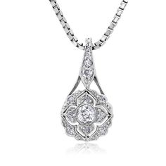 This is part of Chairish’s Fine Jewelry assortment.  Introducing the exquisite Art Deco Floral Diamond Pendant Necklace—a true embodiment of timeless elegance and sophistication. Crafted with meticulous attention to detail, this captivating piece showcases a dazzling 0.55 carat diamond set in a lustrous 18-karat white gold setting. The pendant's design draws inspiration from the Art Deco era, characterized by its geometric patterns and intricate motifs. The centerpiece of this necklace features a brilliant round-cut old European diamond, meticulously chosen for its exceptional clarity and radiance. The diamond's facets are expertly cut to maximize its brilliance, reflecting light from every angle and creating a mesmerizing play of sparkle. One Old European center diamonds weighing 0.20 car Exquisite Oval Necklace With Single Cut Diamonds, Exquisite Platinum Necklace With Single Cut Diamonds, Exquisite Diamond Cut Necklace In Diamond White, Refined Silver Necklace With Single Cut Diamonds, Elegant Teardrop Pendant Diamond Necklace For Anniversary, Refined Wedding Pendant Jewelry, Exquisite Diamond Necklace With Intricate Design, Elegant Diamond Teardrop Pendant Necklace, Elegant Teardrop Diamond Necklace