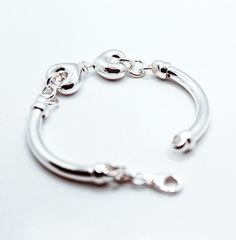 Brand: Argentidea Jewelry Instagram: https://www.instagram.com/gioielli_argentidea/ Size: One size Weight: 17g. Silver colour Women's bracelet, in 925 silver, central motif with double jointed hearts. The hearts are 16mm wide. Side round tube with an external diameter of 5 mm. The bracelet features an oval lobster clasp. The bracelet is the natural color of silver, manually polished to a shiny finish. A completely handcrafted jewel, conceived, designed, produced and finished entirely by hand by Sterling Silver Bangle With Heart Charm, Elegant Sterling Silver Bracelet With Heart Charm For Everyday, Elegant Everyday Sterling Silver Bracelet With Heart Charm, Sterling Silver Bracelets With Lobster Clasp In White Gold, Elegant Adjustable Sterling Silver Bracelet With Heart Charm, Adjustable Sterling Silver Bracelet With Heart Charm, Silver Heart Bracelet For Everyday Elegance, Elegant Everyday Sterling Silver Heart Bracelet, Elegant Everyday Heart-shaped Sterling Silver Bracelet