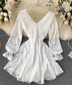 Cute v neck lace short dress lace dress Fabric: lace Color: white, black Size: free size length 72 bust 80-88 waist 60-72 sleeve length 54 Spring V-neck Dress With Lace Sleeves, Elegant V-neck Dress With Scalloped Lace, White V-neck Crochet Dress For Party, Summer V-neck Lace Dress, Elegant V-neck Crochet Dress For Summer, V-neck Mini Dress With Lace Sleeves For Party, Feminine V-neck Delicate Lace Dress, Elegant Lace V-neck Party Dress, Feminine Mini Dress With Lace Top