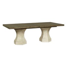 a wooden table with two white pedestals on the top and one is made out of concrete