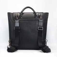 Unisex black backpack. Mens Backpack, womens backpack. Crafted in sleek Italian saffiano leather with python detail. Gregory has a modern slim profile with space for a laptop, tablet or iPad. Gregory Backpack, Satchel Tote, Italian Leather, Python, Smooth Leather, Leather Trims, Zip Pockets, Grain, Adjustable Straps