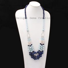 Product Details : ITEM : AQUAMARINE, LAPIS LAZULI, PEARL BEADED NECKLACEItem Code : DGC2539Gemstone Name :  AQUAMARINE, LAPIS LAZULI, PEARLChain Style : BEADEDBeads Shape : Smooth Round/RondelleBeads Size : 6mm/7mm/10mm/12 mm ApproxLength : 24"-26" Inch ApproxWeight : 530 Cts. ApproxCustomization : **Available**Please Feel Free To Contact If You Have Any Query. Light Blue Gemstone Beads For Jewelry Making, Elegant Blue Faceted Beads, Handmade Blue Pearl Necklace With Round Beads, Handmade Blue Round Beaded Pearl Necklace, Blue Oval Faceted Bead Jewelry, Elegant Blue Beaded Necklace With Faceted Beads, Blue Oval Beads Gemstone Jewelry, Blue Crystal Necklace With Polished Round Beads, Blue Bohemian Pearl Necklace With Gemstone Beads