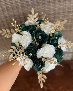 a bridal bouquet with white and green flowers