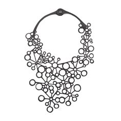 Eco-Friendly and Vegan Inner Tube Necklace Luxury is in each detail – Hubert de Givency. Our Octa Handcraft Black Statement Necklace is not short of wow factor and handcrafted details. Octa in Greek means eight. This black statement necklace is designed to look like there are multiple circles that represent 8. The black statement necklace is handcrafted using recycled tyre inner tubes in a way which is both eco-friendly and cruelty-free. The reclaimed rubber makes a great vegan leather substitut Otiumberg Necklace, Elegant Statement Necklace, Necklace Luxury, Tyres Recycle, Tube Necklace, Art Necklaces, Bib Necklaces, Inner Tube, Inner Tubes