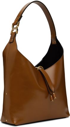 LWG-certified crackled calfskin tote in tan. · Studs throughout · Logo hardware at integrated shoulder strap · Logo embossed at face · Tab-slot closure · Zip pocket at suede interior · Logo-engraved gold-tone hardware · H8.5 x W10.5 x D3 · Total height: H18 Supplier color: Clay brown Brown Calf Leather Satchel With Gold-tone Hardware, Cognac Calf Leather Shoulder Bag With Gold-tone Hardware, Brown Calf Leather Bucket Bag With Gold-tone Hardware, Modern Brown Bucket Bag With Gold-tone Hardware, Modern Brown Shoulder Bag With Gold-tone Hardware, Chic Cognac Textured Leather Satchel, Cognac Textured Leather Shoulder Bag For Office, Brown Textured Leather Shoulder Bag For Office, Brown Calf Leather Bucket Bag With Leather Lining