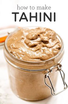 a close up of a jar of food on a table with the words how to make tahn