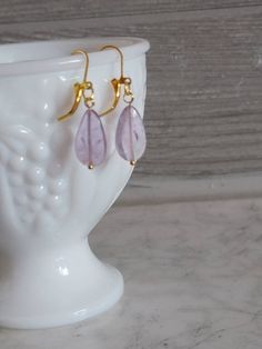 Amethyst earrings,dainty and fun for work or a night out. Hanging on a gold tone latch ear wire. All earrings are handmade to be as close as possible but every stone is unique and individual. Made to be loved and enjoyed. Purple Dainty Earrings With Ear Wire, Dainty Purple Earrings With Ear Wire, Everyday Dangle Crystal Earrings With Ear Wire, Amethyst Wire Wrapped Drop Earrings, Elegant Wire Wrapped Earrings For Everyday, Everyday Crystal Dangle Earrings With Ear Wire, Handmade Amethyst Drop Earrings, Dainty Nickel-free Purple Earrings, Amethyst Earrings For Gift