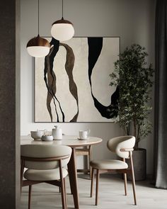 an abstract painting hangs above the dining room table