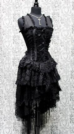 A beautiful french showgirl's corset dress made in black brocade and black lace. A brocade corset top edged all over in rich black lace. Decorative satin ribbon laces up the front with heavy duty corset lace-up in the back. The top has heavy steel boning on the front sides and back. A dramatic four layered black lace skirt longer in the back and shorter in the front with satin lining underneath. Fabulous!! Sizes in this dress: Size 22 = chest 32" waist 23" hips 33" Size 24 = chest 34", waist 24", hips 36" Size 26 = chest 35" waist 26" hips 36" Size 28 = chest 36" waist 28" hips 38" Size 30 = chest 38" waist 30" hips 40" Steampunk Black Wedding Dress, Maskurade Dress, Gothic Tullie Dresses, Steampunk Prom Dresses, Black Broken Glass Dress, Haunted Ball Dress, Brocade Corset Top, Cabaret Dress, Paris Cabaret