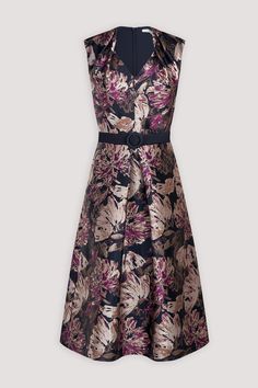 This sleeveless midi dress, crafted from our bestselling medium weight metallic floral jacquard in a fresh colorway, offers a subtle texture with a hint of metal thread. The design features a swan neckline with pleat detailing, a flared skirt with a center front-pleat, and practical pockets. A detachable belt adds versatility to this elegant piece. Swan Neck Fit and Flare Silhouette Midi Length Sleeveless Functional Pockets Detachable Belt Style: 55112508