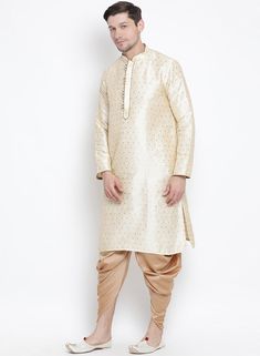 VM By VASTRAMAY Men's Gold Zari Weaved Kurta Dhoti Set Experience the elegance and grandeur of traditional attire with the VM By VASTRAMAY Men's Gold Zari Weaved Kurta Dhoti Set. This exquisite ensemble is designed to make you stand out on any occasion, be it a wedding, festival, or cultural event. The rich gold hue and intricate zari weaving add a touch of luxury and sophistication to your wardrobe. Embrace the timeless charm and grace of ethnic wear with this stunning kurta dhoti set. Key Feat Traditional Fit Sherwani For Festive Transitional Season, Festive Traditional Wear With Traditional Fit And Drape, Traditional Kurta With Traditional Drape For Festive Occasions, Formal Zari Weaving Kurta For Diwali, Formal Sherwani With Zari Weaving In Traditional Drape, Formal Sherwani With Zari Weaving, Traditional Bandhgala With Zari Weaving For Formal Occasions, Formal Kurta With Zari Weaving For Festivals, Formal Festival Kurta With Zari Weaving