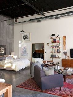 a living room filled with furniture and a flat screen tv