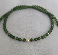 Green jade gemstone beaded chocker,every day necklace Made with smooth 4mm jade beads and 14k solid yellow gold beads and clasp. Please select your prefered length before checkout This minimalist necklace can be worn short as a chocker or longer alone or layered with other necklaces  Measures: 💚4mm  jade smooth beads 💚2mm and 4mm solid gold beads 💚6mm spring ring clasp 100% 14k solid gold hallmarked on clasp Round 8mm Bead Jewelry Gift, Dainty Jade Jewelry Gift, Minimalist Jade Gemstone Jewelry, Jade Necklaces With Round Beads For Gifts, Jade Necklace With Round Beads For Gifts, Jade Bead Necklace For Gifts, Dainty Jade Gemstone Jewelry, Minimalist Jade Jewelry For May Birthstone, Minimalist Jewelry With 8mm Beads For Gifts