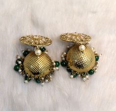 Dark Gold jhumka earrings tikka set. Earrings length: 2.8 inches (with drops) Stud diameter- 1.2 inches Dome Size: 1.1 inches Green Bridal Earrings With Latkans For Diwali, Green Latkan Bridal Earrings For Diwali, Green Latkans Bridal Earrings For Diwali, Green Stone Work Jhumkas For Celebration, Green Chandbalis With Gota Work For Wedding, Green Chandbalis With Latkans For Celebration, Green Bollywood Bridal Earrings For Festive Occasions, Bollywood Style Green Bridal Earrings For Festive Occasion, Green Bridal Earrings With Latkans For Celebration