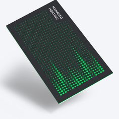 an electronic device with green dots on the front and back cover, sitting on a white surface