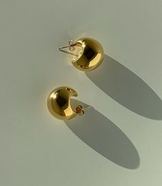 The Genevieve is for the classic girl- the perfect "quiet luxury" moment to add to your collection. Reminiscent of old Hollywood but updated for today, these earrings pair perfectly with classic tailoring or your favorite pair of jeans. Simple, bold, and perfect for everyone. 18K gold plating on stainless steel Water resistant, hypoallergenic Classic Tailoring, Classic Girl, Quiet Luxury, Steel Water, For Today, Old Hollywood, Gold Plating, For Everyone, 18k Gold