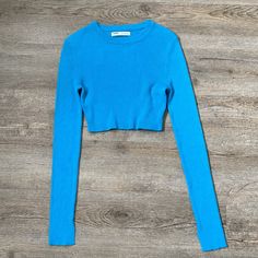 Pull And Bear Knit Long Sleeve Crop Top In Blue. Very Breathable And Light. In The Size Small. Tight Fit And Very Flattering. Never Worn Trendy Cropped Blue Sweater, Blue Ribbed Crew Neck Crop Top, Blue Ribbed Crop Top With Crew Neck, Blue Ribbed Stretch Crop Top, Blue Stretch Ribbed Crop Top, Blue Ribbed Stretch Sweater, Blue Stretch Ribbed Sweater, Trendy Blue Ribbed Sweater, Blue Fitted Casual Sweater