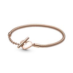 Add a warm-toned accent to your look with the Pandora Moments Heart T-Bar Snake Chain Bracelet. Hand-finished in a 14K rose gold-plated unique metal blend, this piece is an updated take on the Pandora Moments snake chain bracelet. Featuring a heart-shaped T-bar double circle closure, loop the T-bar through the smallest circle to guarantee that the bracelet clasp is securely closed. Wear this sleek, modern style with up to 10-13 Pandora Moments charms and dangles. Bracelet Pandora, Snake Chain Bracelets, Silver Snake Chain, Bar Bracelets, Gold Bracelet Chain, Pandora Bracelets, The Avengers, Pandora Bracelet, Pandora Jewelry