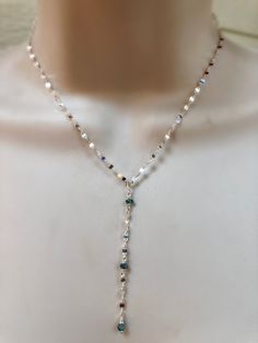 "This is one of my favorite chains to use, so fluid and shimmery. This cool tone sterling silver picks up all the colors in the rainbow. I placed faceted moonstones and blue topaz stones intermittently with bezel pendants on two of the strands. Each strand is separate with its own clasp and extension chain. Each necklace is sold separately or you can purchase all three as a set at a lower price. The top necklace with the Blue Topaz bezel pendant measures 15\" inches and comes with an additional Silver Wire Wrapped Necklaces, Blue Sterling Silver Lariat Jewelry, Silver Adjustable Teardrop Crystal Necklace, Silver Adjustable Teardrop Crystal Necklaces, Blue Sterling Silver Lariat Necklace, Blue Sterling Silver Lariat Necklace Gift, Unique Silver Lariat Necklace, Iridescent Moonstone For Jewelry Making, Silver Spiritual Lariat Necklace As Gift