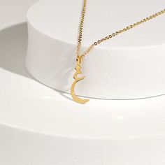 This stunning necklace features a beautifully crafted pendant with a personalized Arabic letter. The elegant design of the letter captures its unique and intricate beauty, making it a focal point of sophistication and charm. The pendant hangs from a delicate chain, perfect for adding a touch of elegance to any outfit. Ideal for everyday wear or special occasions, this necklace makes a meaningful and stylish statement. It also serves as a thoughtful and personalized gift for loved ones, celebrati Elegant Sterling Silver Crescent Charm Necklace, Elegant Moon Charm Jewelry Gift For Her, Silver Gold Plated Initial Necklace, Elegant Initial Pendant Necklace As Gift, Elegant Initials Pendant Jewelry, Silver Gold-plated Initial Necklace, Elegant Sterling Silver Necklace With Moon Charm, Elegant Sterling Silver Moon Charm Necklace, Elegant Gold Monogram Necklace