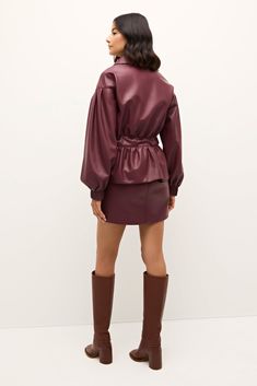 There are some looks from the 80s and 90s we’re happy to leave in the past, but this exaggerated bomber jacket with feminine puff sleeves, long elastic cuffs, and a tie belt with trapunto stitch detailing isn’t one of them. Pictured here in Merlot, our new Chazz jacket looks contemporary and chic paired with our matching Vallie skirt. -Hidden zipper front placket-Drop shoulder with trapunto stitch waist tie belt-Pleated cuff detail-100% polyester-Fully lined-Care instructions: spot clean only Belt Tying, Cuff Detail, Merlot, Fine Fabric, Women Empowerment