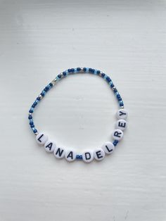 Lana Del Rey beaded bracelet. Made to fit each customers wrist. Can personalise colour of beads Casual Customized Blue Beaded Bracelets, Customized Blue Friendship Bracelets, Casual Custom Name Beaded Bracelets With Round Beads, Custom Name Blue Bracelets With Round Beads, Customized Adjustable Blue Bracelets, Adjustable Blue Jewelry With Custom Name, Customizable Casual Beaded Bracelets, Casual Custom Name Beaded Bracelets, Blue Jewelry With Custom Name