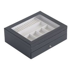 a black jewelry box with two compartments on the top and one drawer open to show an empty