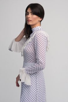 Long sleeve with ruffle details on arms and the frontHas contrasting pleatsRuns small, no stretch in waistbandModel wears size XSModel is 172cm/5'8" with 25 waist, 32 bust, 34 hips 80% Chiffon 20% PolyesterDry clean onlyMade in Armenia Dot Dress, Polka Dot Dress, Ruffles, Polka Dots, Ruffle Blouse, Chiffon, White, Long Sleeve, Women's Top