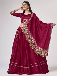 Introducing our amazing maroon gamthi work silk navratri wear lehenga choli, made with maroon satin silk material. This stunning ensemble is perfect for traditional occasions like Navratri, where you want to look elegant and festive.
Let's talk about the benefits of this beautiful lehenga choli. It is made with high-quality satin silk material, ensuring a smooth and comfortable fit. The maroon color adds a touch of sophistication and grace to the overall look. The gamthi work on the choli and at Satin Silk Lehenga, Plain Lehenga, Gamthi Work, Chaniya Choli Designs, Silk Lehenga Choli, Navratri Dress, Lehenga Fabric, Lengha Choli, Choli Designs