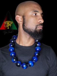 This handsome and eye catching piece is hand crafted and created by Eye Create LLC.  This item is stained in a beautiful custom made deep and vibrant royal blue. All stains are made by our company. All beads are solid and hand drilled by yours truly. These beads are highly glossed and stands out like no other!  The necklace can be purchased individually or as a set with the matching bracelet.   The bracelet is made from natural Blue Tiger eye, Black Obsidian, and Hematite gem beads.    Please fo Unique Blue Wooden Beads, Blue Wooden Beads, Artisan Blue Wooden Beads, Unique Blue Wooden Beaded Necklaces, Traditional Blue Jewelry With Wooden Beads, Blue Wooden Beads Jewelry For Jewelry Making, Blue Wooden Beads Necklace As Gift, Blue Necklaces With Wooden Beads For Gift, Blue Wooden Beads Necklace For Gift