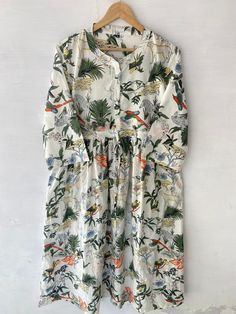 h Flowy Cotton A-line Midi Dress, Relaxed Cotton Dress For Garden Party, Relaxed Fit Cotton Dress For Garden Party, Multicolor Relaxed Fit Cotton Dress, Multicolor Cotton Dress With Relaxed Fit, Cotton Tropical Print Dress For Day Out, Casual Cotton Floral Dress For Vacation, Multicolor Cotton Floral Dress For Vacation, Cotton Relaxed Fit Sundress Midi Dress