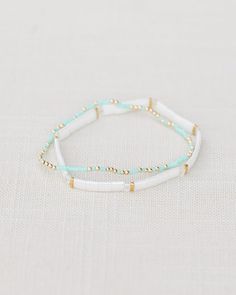 Tila bracelet - Pina Colada Turquoise Sprinkle - 2mm gold filled beads with splashes of Turquoise glass beads Turquoise Bracelets With Tiny Beads For Gifts, Turquoise Bracelets With Tiny Beads As Gift, Turquoise Heishi Beads Bracelet With Tiny Beads, Turquoise Beaded Bracelets With Gold Beads As Gift, Elegant Turquoise Beaded Bracelets With Tiny Beads, Turquoise Beaded Bracelets With Gold Beads, Turquoise Beaded Bracelets With Gold Accents, Adjustable Turquoise Stretch Bracelet With Tiny Beads, Adjustable 14k Gold-filled Jewelry With Tiny Beads