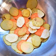 sliced potatoes and carrots in a metal bowl