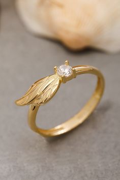 ★14K Solid Gold Angel Wing Ring, 925 Sterling Silver Angel Wing Ring, Cubic Zircon Stone Ring, Dainty Ring, Valentine's Day Gift, Christmas Gift★ ▷ MATERIAL ★ All of our 10K, 14K, 18K Jewelry are Solid Gold. ( Not Gold Filled or Gold Plated ) ★ All of our silver jewelry is 925 sterling silver and 14 carat gold plated. (Our white silver jewelry is rhodium plated.) ▷ PRODUCTION AND PACKAGING ★ Our jewelry is handmade. It is specially prepared for you in the dimensions you want upon order. ★ We work with three colors in our jewelry. Yellow, Rose, White ★ We prepare our jewelry by examining it to the smallest detail with our 21 years of experience. ★ Since we care about customer satisfaction and long-term relationship, we produce our jewelry considering daily use and natural wear. ★ If you wis Angel Wing Jewelry, Wing Ring, Angel Wing Ring, Angel Ring, Book Edits, Sterling Silver Skull Rings, Angel Wings Jewelry, Handmade Gold Ring, Gold Angel Wings