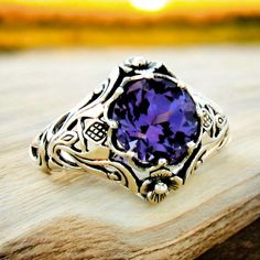 Discover the timeless elegance of our Vintage Scottish Thistle Ring, meticulously crafted from 925 Sterling Silver. This unique filigree jewelry piece features an 8mm color-changing Alexandrite, providing a captivating spectrum of hues. Perfect as a beautiful birthday present, the ring is stamped with 925 for authenticity, ensuring premium quality. Embrace heritage and sophistication with this expert-crafted statement piece, ideal for collectors and admirers of fine jewelry.Introducing our Vintage Scottish Thistle Ring, featuring a color-changing Alexandrite set in 925 Sterling Silver. This meticulously crafted piece showcases intricate filigree detailing and the iconic Scottish thistle design, symbolizing strength and resilience. The unique Alexandrite gem transforms hues under different Ornate Filigree Ring Stamped 925 For Anniversary, Silver Amethyst Ring With Intricate Design For Anniversary, Fine Jewelry Amethyst Ring With Intricate Design For Anniversary, Classic Sterling Silver Amethyst Ring With Intricate Design, Ornate Silver Amethyst Ring For Anniversary, Ornate Amethyst Ring For Anniversary, Elegant Engraved Silver Amethyst Ring, Oval Amethyst Ring In Sterling Silver With Intricate Design, Engraved Sterling Silver Amethyst Ring For Anniversary