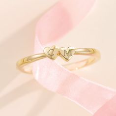 Made of solid 14k gold (not plated, not filled, not vermeil), this ring is available in your choice of yellow, white, or rose gold (as well as platinum upon request) This listing is for a two heart ring but this style is available with one, two, three, four, and five hearts. If you would like a different number of hearts for your ring, please message me for a custom listing. Pricing may vary. Personalize this ring by adding a custom engraving with the initials of your most cherished loved ones - message directly for details! Show your love and gift this sentimental piece to someone special - this ring is delivered in a beautiful gift box ready for gifting Metal: 14K Solid Gold Solid/Hollow: Solid Shank Width: 1.7mm Made-to-order, this item typically ships within 1-10 business days. However Valentine's Day Rose Gold Stackable Rings, Yellow Gold Jewelry For Valentine's Day, 14k Gold Stackable Rings With Initials For Anniversary, Yellow Gold Stackable Rings For Valentine's Day, Yellow Gold Stackable Promise Rings With Initials, Gold Stackable Rings For Wedding On Valentine's Day, Classic Personalized Heart Ring For Promise, Classic Personalized Heart Promise Ring, 14k Gold Polished Finish Promise Heart Ring