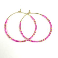 Caryn Lawn Baja Hoop Earrings in Pink. Adjustable Hoop Earrings With Tiny Beads, Nickel-free Adjustable Hoop Beaded Earrings, Hoop Earrings With Tiny Beads, Pink Hoop Beaded Earrings With Tiny Beads, Colorful Beads Hoop Earrings, Adjustable Small Hoop Earrings Nickel Free, Trendy Nickel-free Beaded Hoop Earrings, Pink Tiny Beads Hoop Earrings, Trendy Adjustable Hoop Jewelry