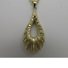 Style: Diamond Cut Puffy Pear Shape Pendant Length: 1.50" (Approx.) Weight: 2.16g (Approx.) Metal: 14k Solid Yellow Gold Note: Chain Is Not Included. Gold Teardrop Jewelry Stamped 14k, 14k Gold Pear-shaped Jewelry, Yellow Gold Teardrop Jewelry Stamped 14k, Yellow Gold Diamond Cut Teardrop Jewelry, Yellow Gold Pear-shaped Necklace With High Luster, Yellow Gold Drop Jewelry With Shiny Finish, Gold Hallmarked Teardrop Pendant Jewelry, Teardrop Yellow Gold Jewelry With High Luster, Hallmarked Pear-shaped Yellow Gold Jewelry