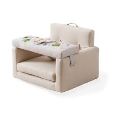 a baby's chair with a changing table attached to the back and seat cushion