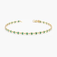 Handmade Natural Emerald Tennis Bracelet In Solid 14k Gold Elegant Green Gemstones For Formal Occasions, Timeless Green Jewelry With Bezel Setting, Luxury Green Oval Bracelet, Timeless Green Birthstone Jewelry, Green Diamond Bangle Bracelet For Formal Occasions, Luxury Green Diamond Bracelet Hand Set, Yellow Gold Bracelet With May Birthstone Gemstone, Formal Green Diamond Bangle Bracelet, Luxury Green Hand Set Diamond Bracelet